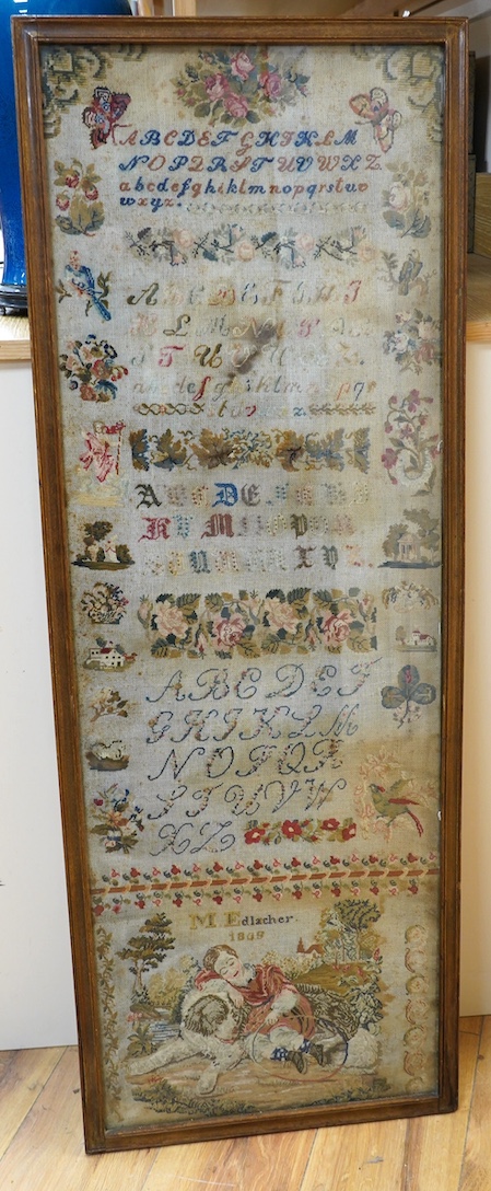 A 19th century framed alphabet sampler worked by M. Edlacher, overall 114cm high. Condition - poor